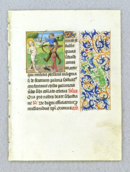 (ST12021-244) TEXT FROM THE SUFFRAGES OF THE SAINTS. FROM AN ENGAGING LITTLE BOOK OF HOURS IN LATIN AN ILLUMINATED VELLUM MANUSCRIPT LEAF WITH A. SMALL MINIATURE OF SAINT SEBASTIAN.