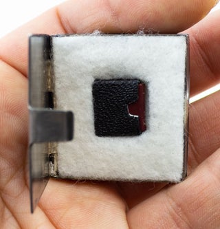 A SMALL COLLECTION OF DESIRABLE MINIATURE BOOKS, OFFERED AS A GROUP.