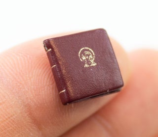 A SMALL COLLECTION OF DESIRABLE MINIATURE BOOKS, OFFERED AS A GROUP.