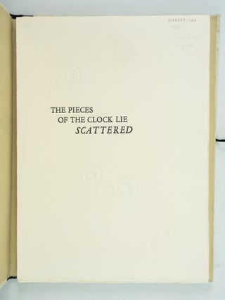 THE PIECES OF THE CLOCK LIE SCATTERED.